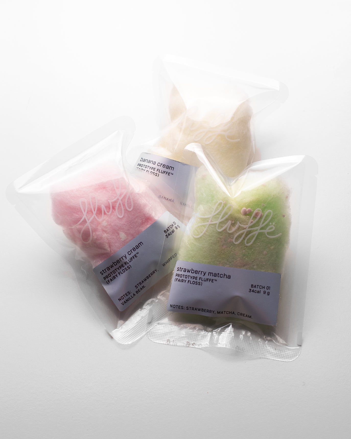 Fluffe fire mango single pack of fairy floss/cotton candy on a white background